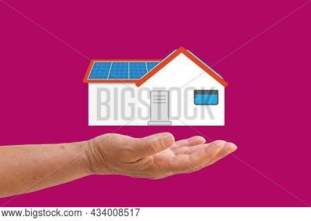 Green Energy Concept. Solar Energy Equipment On A Hand. Closeup With Space For Text.