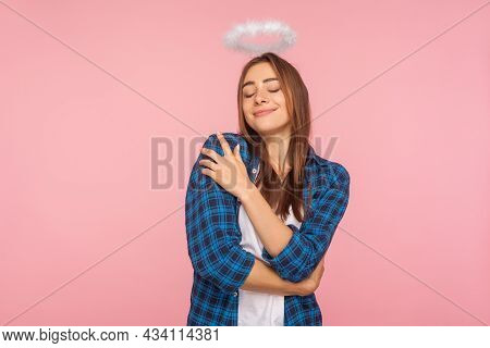 Im The Best. Self-love Concept. Portrait Of Attractive Girl In Casual Shirt And With Nimbus Over Hea