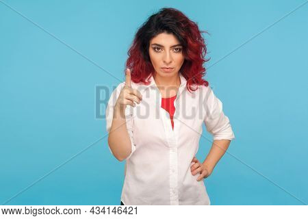 Be Careful. Portrait Of Bossy Displeased Hipster Woman With Fancy Red Hair In White Shirt Holding Fi