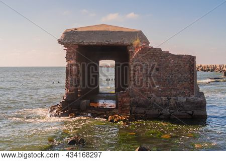 Ruins Of A Brick Walls Building. Old Ruined Fortress By The Sea. Stock Photo. Baltic Sea, Kaliningra