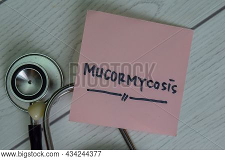 Mucormycosis Write On Sticky Notes Isolated On Wooden Table.