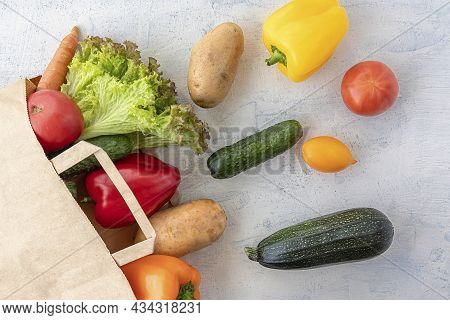 Paper Bag With Carrots, Cucumbers, Bell Peppers, Patatoes, Lettuce And Tomatoes. Eco Concept For Sho