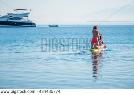 Happy Family On Sup Stand Up Paddle On Vacation.