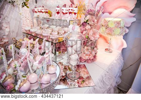 Delicious Desserts At The Wedding Candy Bar In The Buffet Area: Statuette, Figurine, Cake Pops, Mars