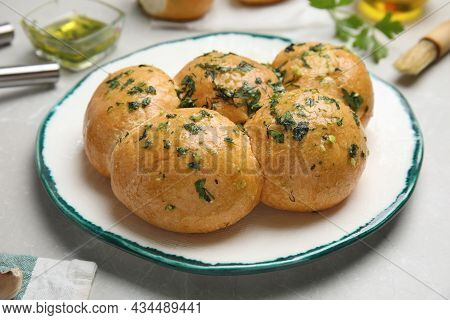 Traditional Ukrainian Bread (pampushky) With Garlic On Light Table