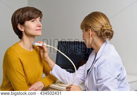 Faceless Medical Worker Conducting Thorough Scan Of Cervical Veins And Arteries, Examines Throat. Mo