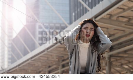 Lay Off. Sacked. Fired Business Woman Sitting On Stairs Of Office Building Outside.