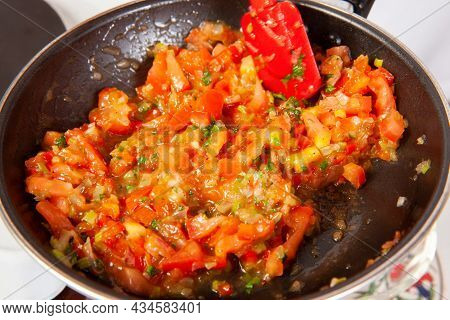 Preparation Of The Traditional Colombian Hogao Or Criollo Sauce (salsa Criolla) Made Of Onion, Tomat