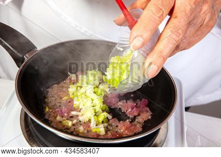 Preparation Of The Traditional Colombian Hogao Or Criollo Sauce (salsa Criolla) Made Of Onion, Tomat