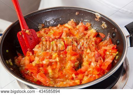 Preparation Of The Traditional Colombian Hogao Or Criollo Sauce (salsa Criolla) Made Of Onion, Tomat