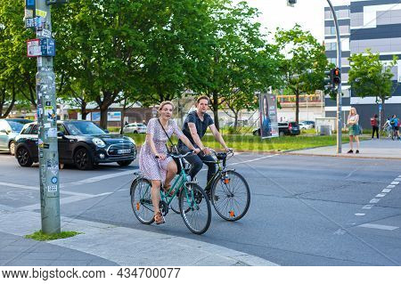 City Dwellers Ride Their Bicycles Around The City. An Ecological Mode Of Transport And The Fight Aga