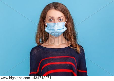 Serious Woman Wearing Striped Casual Style Sweater And Medical Mask Prevent Infection, Airborne Resp