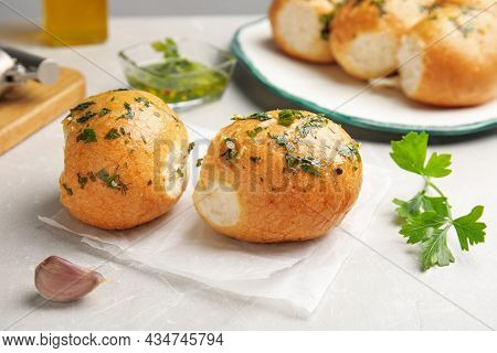 Traditional Ukrainian Bread (pampushky) With Garlic On Light Table