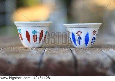 Two Tradional Lebanese Coffee Cups On A Wooden Table.