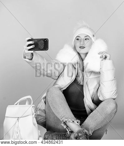 Girl In Puffed Coat Make Selfie. Faux Fur Fashion. Warm Winter Clothing. Phone Selfie. Flu And Cold 