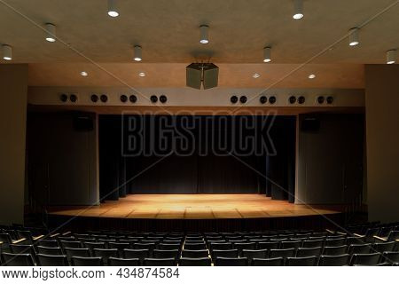 Palo Alto, California - September 29, 2021: Empty Stage Auditorium With Lit Stage And Black Curtain 