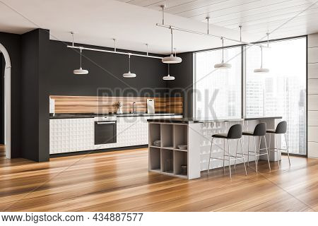 Corner Of The White And Grey Panoramic Kitchen Interior With Stylish Furniture, Ceiling Lamps, A Woo