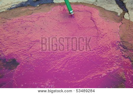 Wine vinasse rich in tartaric acid in magenta pink color cleaning the dregs of barrels