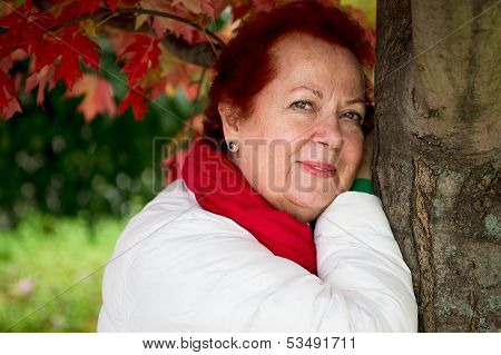 Red Hair Senior Lady Looking At You Happily