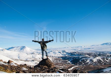 Man at Icelandic ice desert landscape
