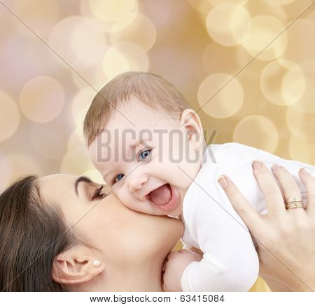 family, child and happiness concept - happy mother with baby