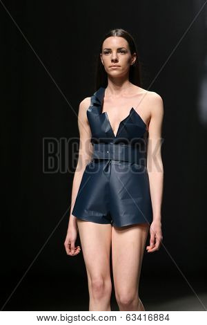 ZAGREB, CROATIA - APRIL 10 : Fashion model wears clothes made by Petra Vuletic and Sasa Hortig on 