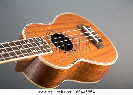 Close-up shot of classic ukulele guitar, selective focus on pattern 