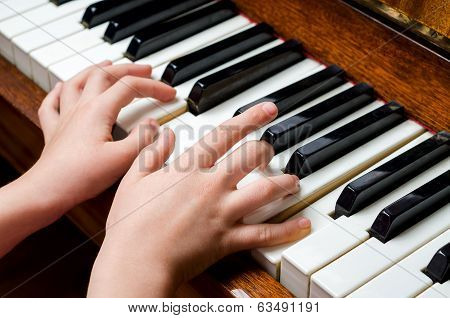 Child Hands Playing Piano
