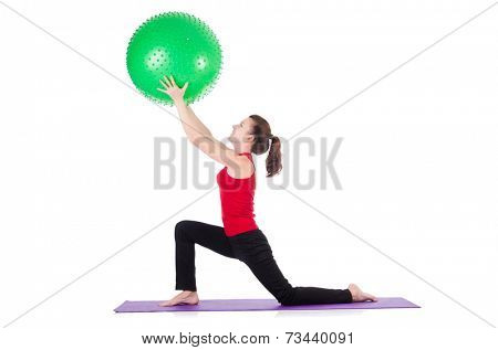 Young woman exercising with swiss ball