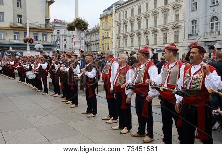 ZAGREB, CROATIA - OCTOBER 04: The parade of 70 participants, thirty horses and forty members of a brass band to the main square were announced next, 300th Sinjska Alka, on October 04, 2014 in Zagreb.