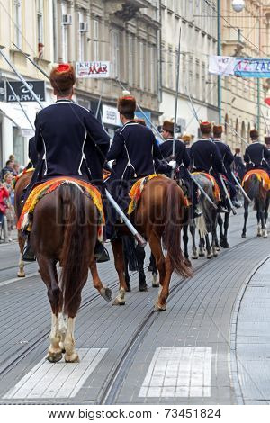 ZAGREB, CROATIA - OCTOBER 04: The parade of 70 participants, thirty horses and forty members of a brass band to the main square were announced next, 300th Sinjska Alka, on October 04, 2014 in Zagreb.