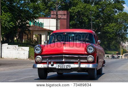 HAVANA,CUBA - June 27, 2014: Red classic car on the road in havana
