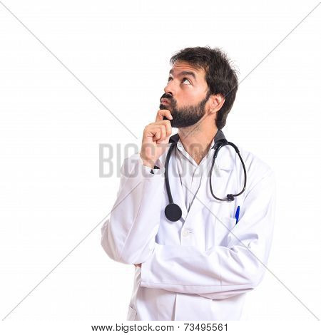 Doctor Thinking Over Isolated White Background