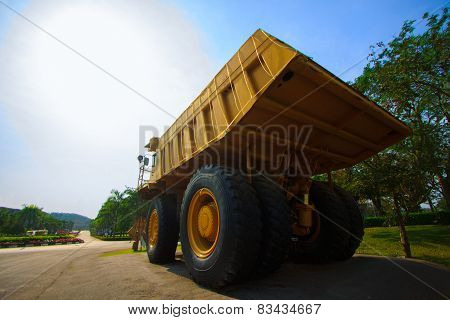 Heavy mining truck in mine and driving along the opencast. Photo of the big mine truck