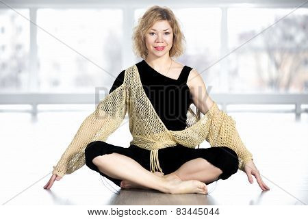 Happy Yogi Female Sitting Cross-legged In Yoga Pose