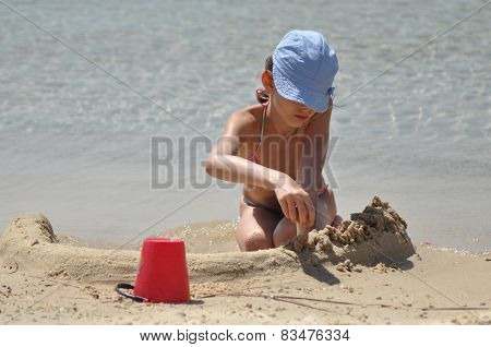 Girl Sticky Sand Castles. The Sea And Beach In An Exotic Country. Tourism.