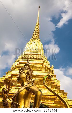 Golden Kinnari Statue At Temple Of Emerald Buddha (wat Phra Kaew) In Grand Royal Palace. Bangkok, Th