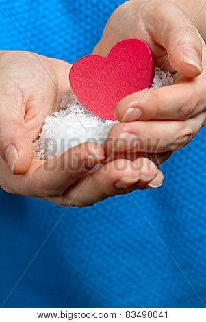 Heart between her hands