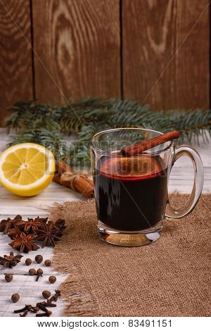 Mulled wine, punch and spices for glintwine on wooden background