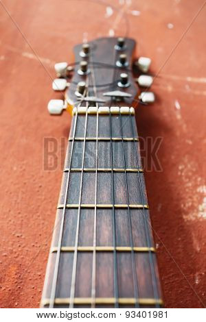 guitar on a brown background