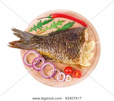 Fried carp tail with lemon and pepper.