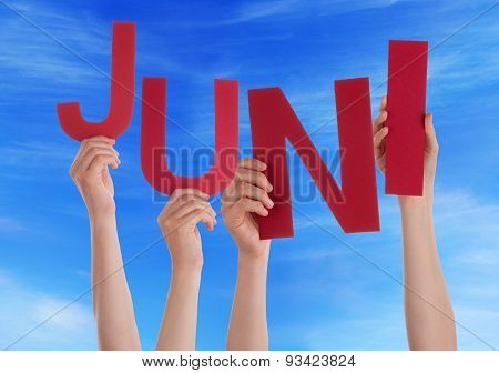 People Hold German Word Juni Means June Blue Sky