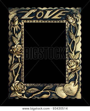 Old antique gold frame isolated on a black background.