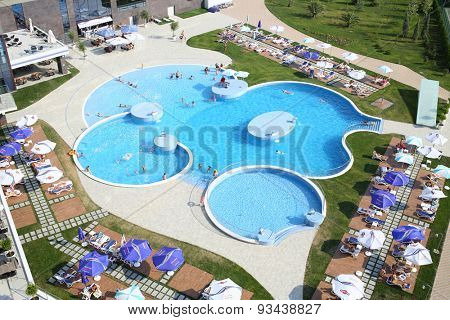 SOCHI, RUSSIA - JUL 26, 2014: Large swimming pool with tourists on site Hotel Radisson Blu Paradise Resort and Spa