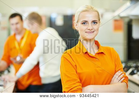 Positive seller or shop assistant portrait  in supermarket store