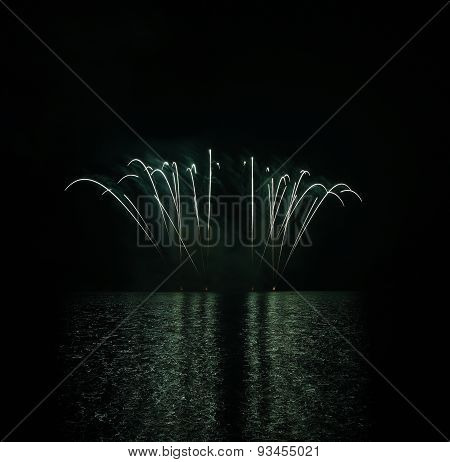 Colorful Fireworks With Reflection On Lake.