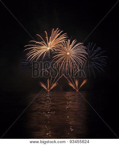 Colorful Fireworks With Reflection On Lake.