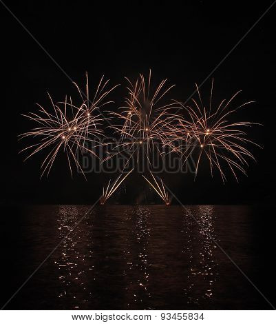 Colorful Fireworks With Reflection On Lake.