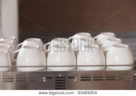 Empty coffee cup on coffee machine