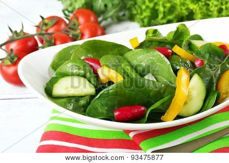 fresh vegetable salad in bowl on table close up